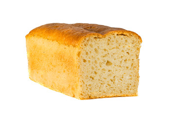 A traditional square loaf of bread is isolated on a white background. Wheat bread isolated on a white background. 