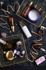 set of nature precious oils and  care cosmetics on black background .