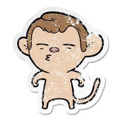 distressed sticker of a cartoon suspicious monkey