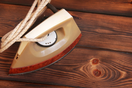 Old Iron On Wooden Background