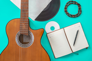 Fototapeta premium song writer table a workspace with musician acoustic guitar and notepad paper