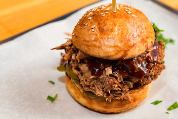 Close up tasty burger with minced meat served on tray