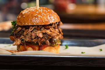 Close up tasty burger with minced meat served on tray