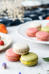 Macaron or French macaroon cookies dessert. Set on cafe table.