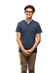 Fototapeta premium Teenager man with glasses and happy over isolated white background