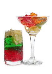Coctail in a glass with raw fruit on white background