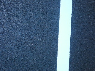 Closed up at asphalt road. It's just finished not long time, looking clean and new.