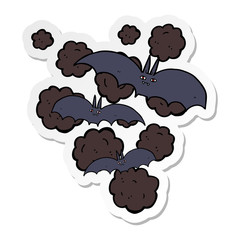 sticker of a cartoon vampire bats