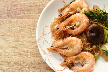 shrimp steamed with glass noodle and ginger on white plate