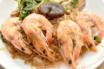 shrimp steamed with glass noodle and ginger on white plate