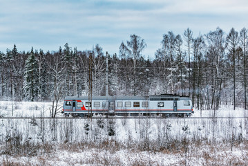 Railway managers move by the railcar at winter day time.