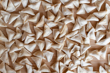 raw, uncooked triangle shaped manti. traditional turkish food. turkish ravioli