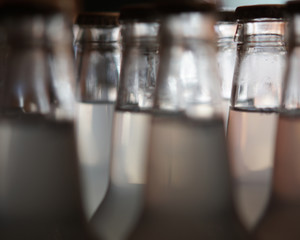 Soda Bottles Filled With Opaque Beverage