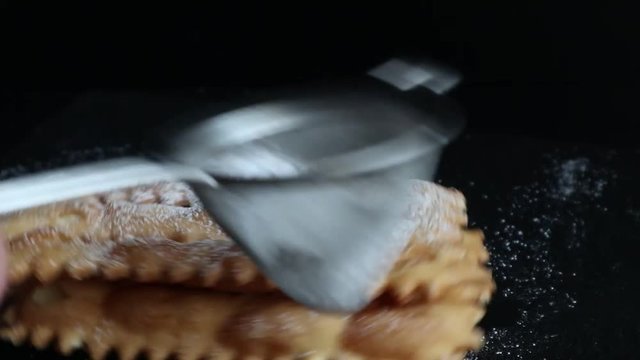 Carnival fritters topped with icing sugar, a typical Italian sweet of Carnival celebrations.