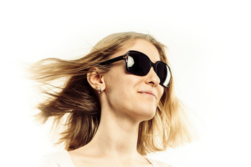 face of a pretty girl blonde in sunglasses close-up on a white background