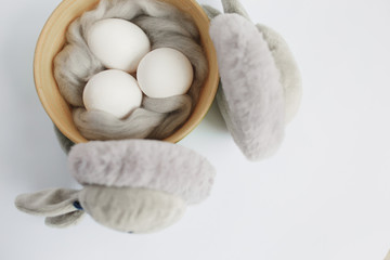 Easter. Easter eggs. Bokeh. Silver. Bowl with eggs