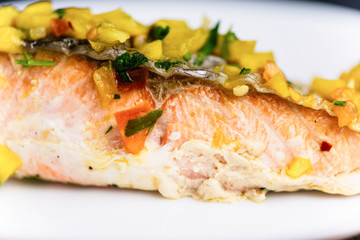red fish salmon grilled with vegetables and sweet and sour sauce