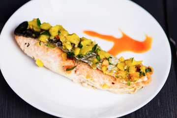 red fish salmon grilled with vegetables and sweet and sour sauce