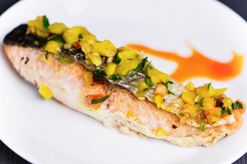 red fish salmon grilled with vegetables and sweet and sour sauce