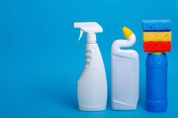 set of cleaning products for home cleaning on blue background