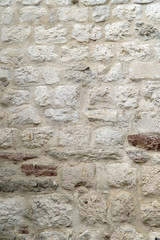 The texture of the old wall of stone bricks.