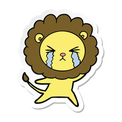 sticker of a cartoon crying lion