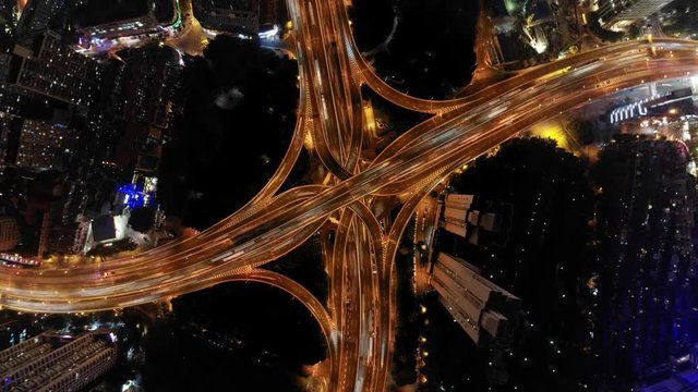 City highway interchange at night transition to tiny planet.  Drone shot from above of city planet surreal 360 panorama shot. Little planet warped view effect of Shanghai cityscape.