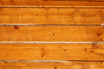 The wall of wooden beam. Close-up. Horizontal view. Background. Texture.