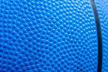 Blue basketball texture with lines, macro close-up.