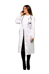 Full body of Young doctor woman using mobile phone