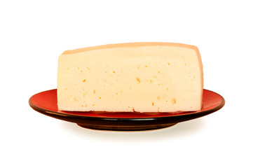 Cheese hard on a red saucer. Milk product. Source of proteins, trace elements, vitamins. Isolated on white background.