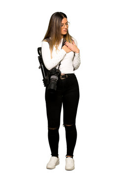 Full body of Young photographer woman having a pain in the heart