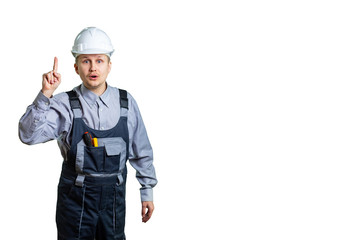 The civil engineer, pointing with his finger at the top, remembered the incredible idea of repair or construction. isolated