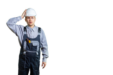 A civil engineer, holding his hand on his helmet, made a huge mistake when repairing or building. isolated