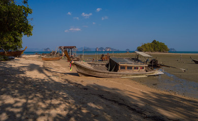 Boat in a low tide beach