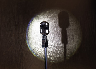 spotlight retro microphone on stage