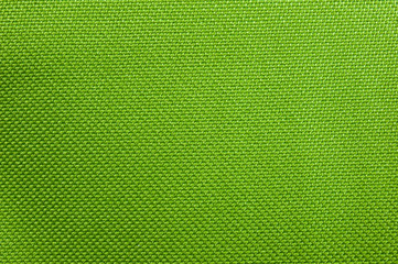 Texture of dense bright green fabric used in thermo bags