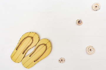 Summer shoes on white background. Beach flip flops. Summer background. Copy space.
