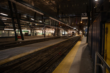 Fototapeta na wymiar TORONTO CANADA - February 16, 2019: Green wagons of speed Toronto’s GO train at Platform of Union Station