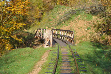Wooden bridge on the narrow gauge road Mezmay-Guamka. Russia