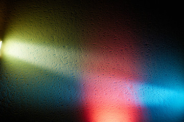 Red glow separates blue and yellow beam light