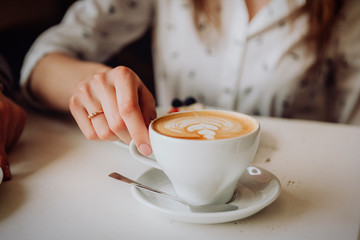 hand with cup of coffee