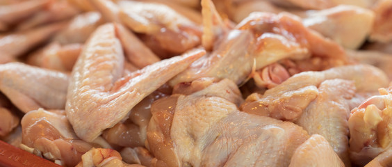 A fresh  chicken wings in the market.