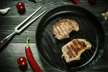 Grilled pork steak on pan