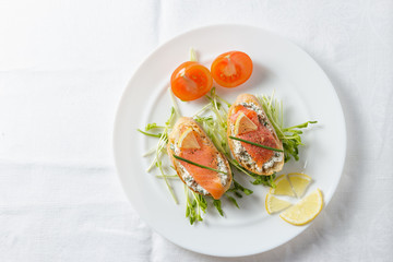 Ricotta and salmon on white bread.