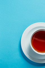 Thyme herbal tea, view from above, space for a text on blue background top view copyspace