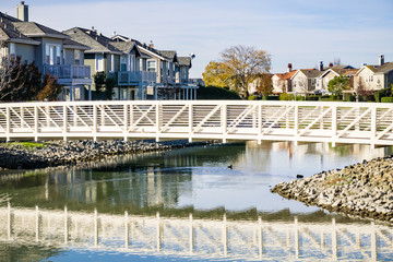 Fototapeta na wymiar Bridge over man made waterway, Redwood shores, San Francisco bay area, California