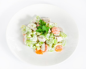 Fresh delicious healthy salad with celery, carrot and meat on white