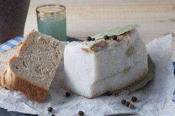 Pork lard with rye bread on a table