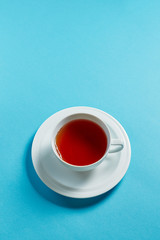 Thyme herbal tea, view from above, space for a text on blue background top view copyspace